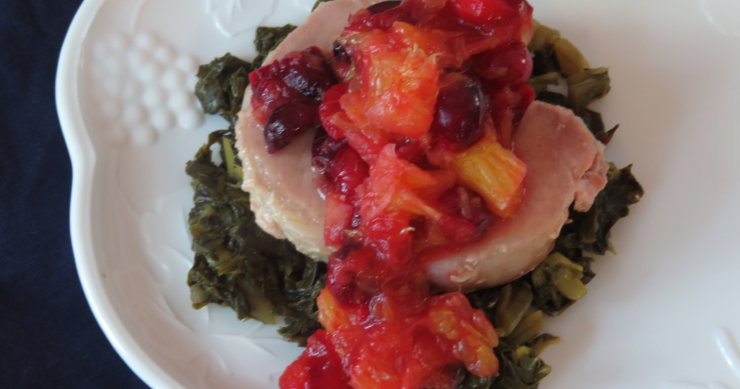 Pork Chop with Cranberry Orange Sauce over Collards